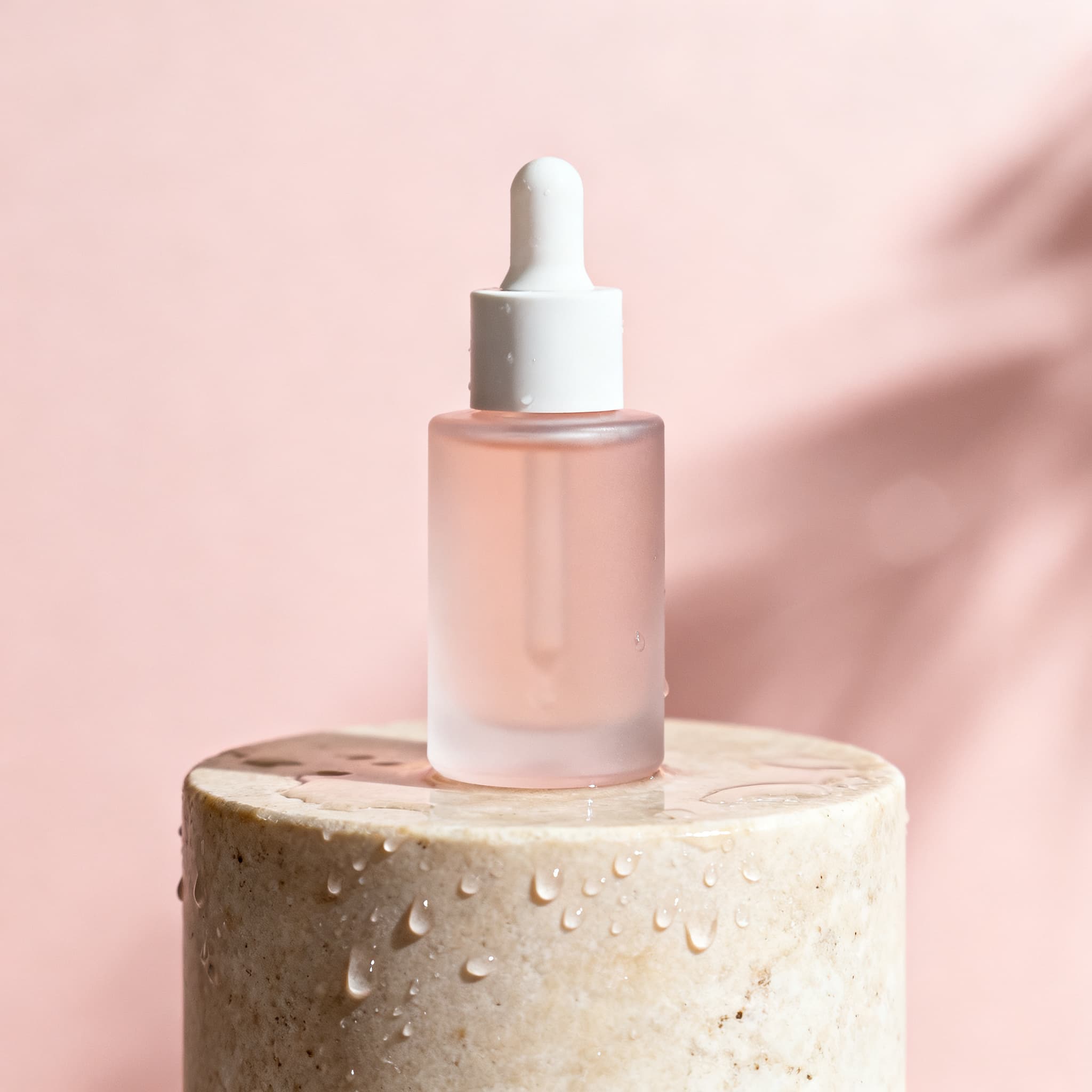 A skincare bottle in soft light