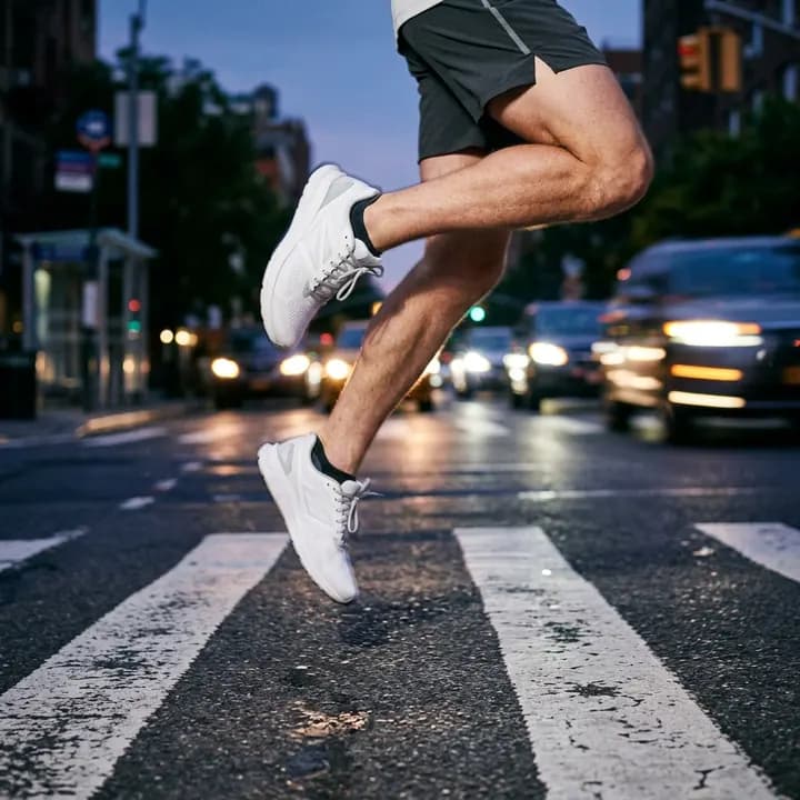 Running shoes over a crosswalk